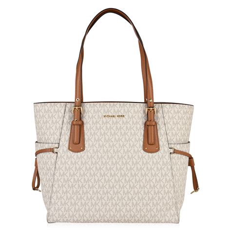 michael michael kors grained leather voyager tote bag|Michael Kors voyager tote merlot.